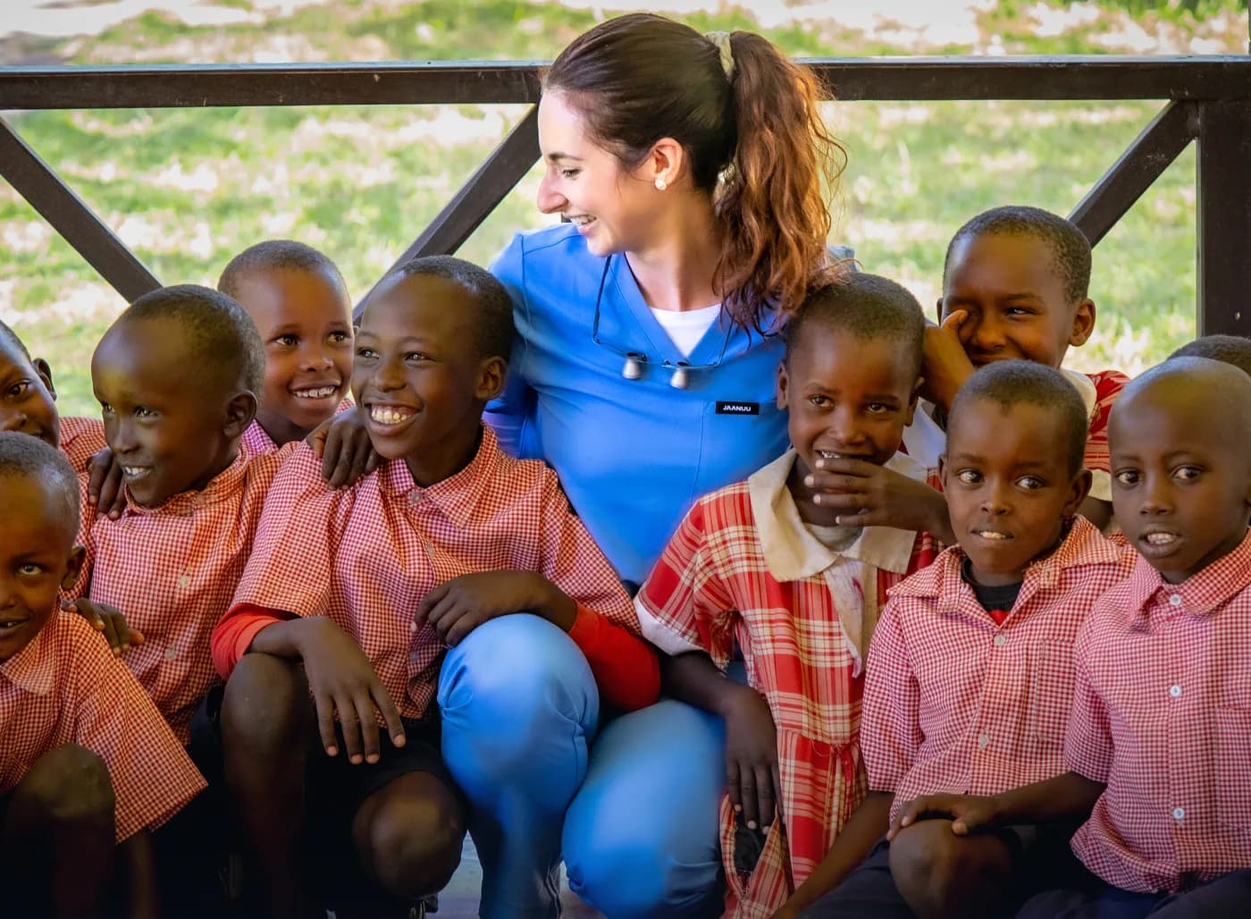 Dentist volunteering with children during an international community outreach program.