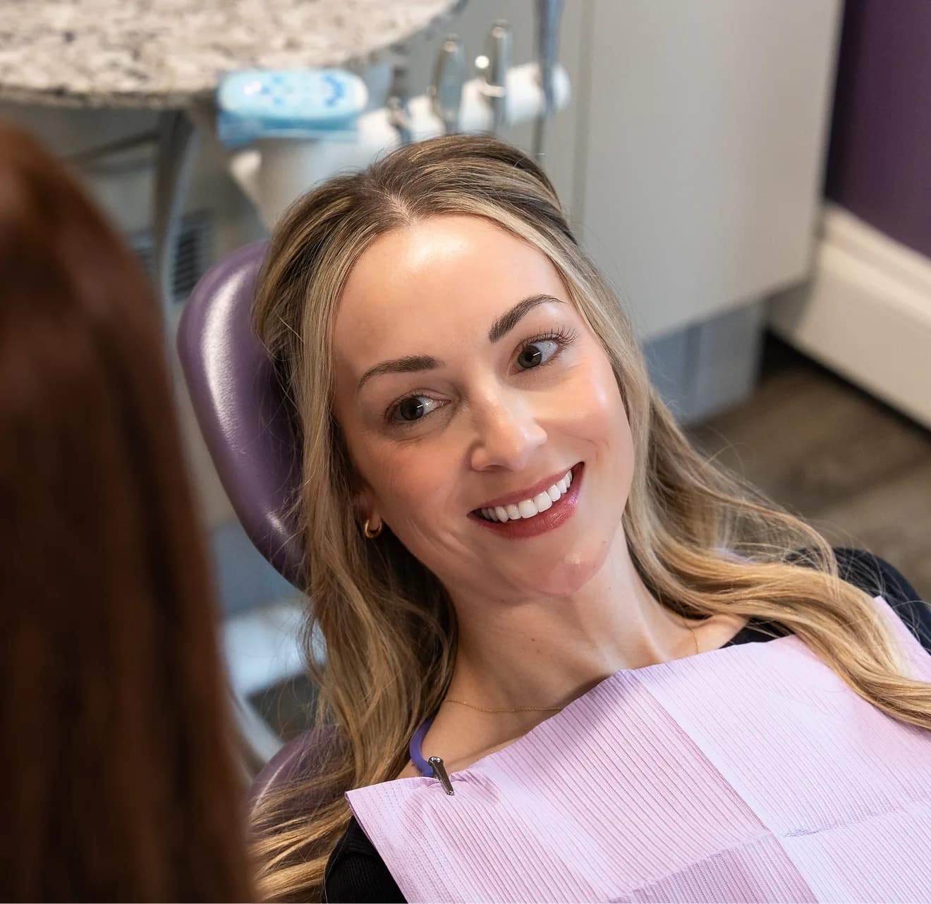 Smiling patient in dental chair